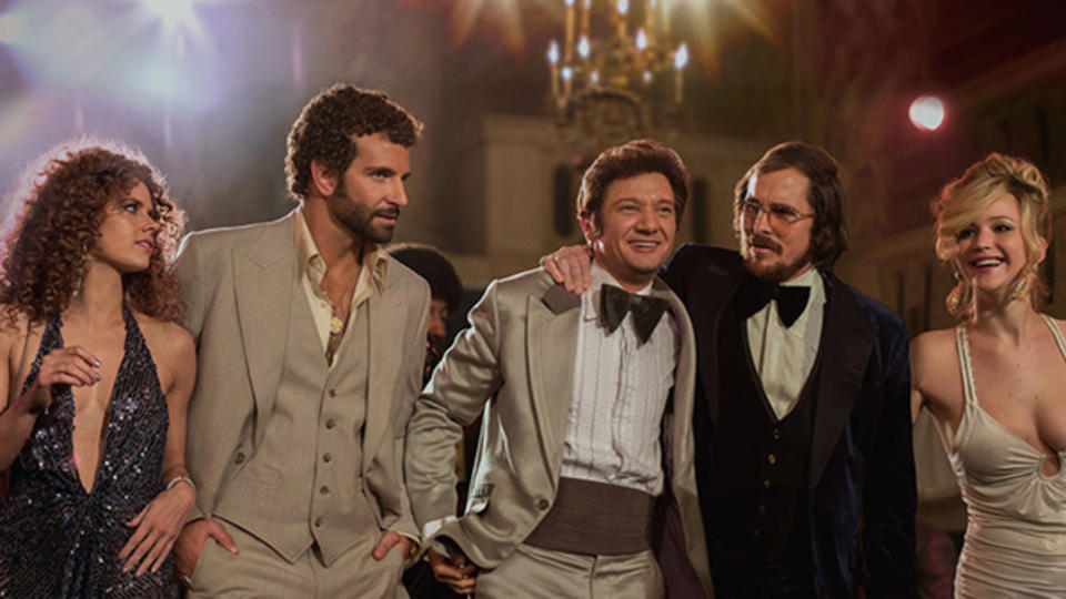 From left, Amy Adams, Bradley Cooper, Jeremy Renner, Christian Bale, Jennifer Lawrence in a scene from American Hustle.