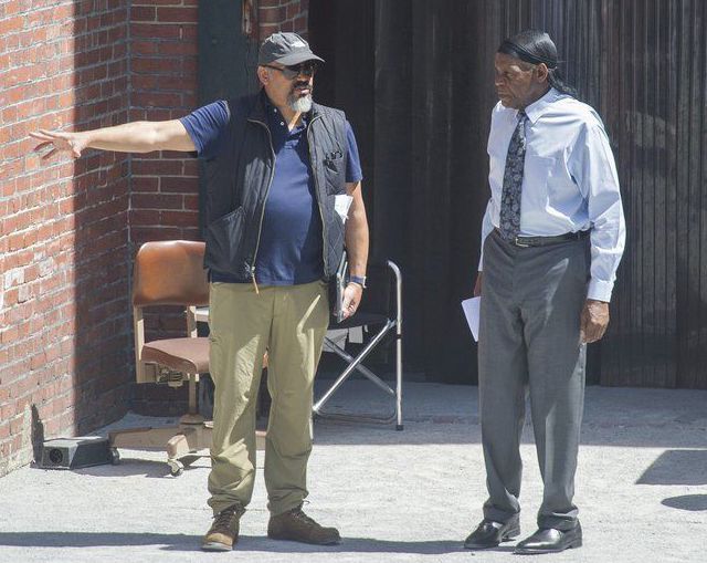 (AMANDA SABGA/STAFF PHOTO) Actor Danny Glover, right, and Mark Little, first assistant director, speak on set of "Proud Mary", a major movie being filmed in Lawrence